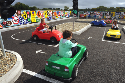 kids driving toy cars